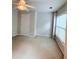 Bedroom with carpet, ceiling fan, door, and natural light at 210 Morning Dove Ln, Suwanee, GA 30024
