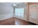 Bright dining area boasts hardwood floors, wainscoting and a large window at 210 Morning Dove Ln, Suwanee, GA 30024