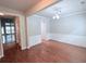 Bright dining room features hardwood floors, a modern light fixture and wainscoting at 210 Morning Dove Ln, Suwanee, GA 30024