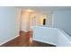 Upstairs hallway that features wood floors and neutral paint at 210 Morning Dove Ln, Suwanee, GA 30024