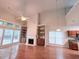 Spacious living room has hardwood floors, fireplace, built-ins, and large windows for natural light at 210 Morning Dove Ln, Suwanee, GA 30024