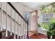 Entryway with hardwood floors, staircase, and view to the front porch at 76 Riverbend Trl, Douglasville, GA 30134