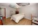 Bedroom with wood-look flooring, neutral walls, and a ceiling fan at 940 Sandy Ford Rd, Social Circle, GA 30025