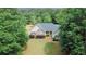 Traditional home with manicured lawn and attractive landscaping at 940 Sandy Ford Rd, Social Circle, GA 30025