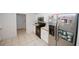 Spacious kitchen featuring stainless steel refrigerator, white cabinets and lots of storage space at 940 Sandy Ford Rd, Social Circle, GA 30025