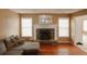 Comfortable living room featuring a stone fireplace and natural light at 940 Sandy Ford Rd, Social Circle, GA 30025