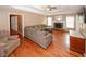 Open concept living area with hardwood floors, fireplace and lots of space at 940 Sandy Ford Rd, Social Circle, GA 30025
