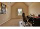 Bedroom with a vaulted ceiling currently staged as a home office at 200 Baumgard Way, Locust Grove, GA 30248