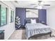 Comfortable bedroom featuring a ceiling fan, artwork, and natural light from the windows at 4266 Roswell Ne Rd # L3, Atlanta, GA 30342