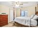 Inviting bedroom with a four-poster bed and a wooden dresser with decorative pulls at 4266 Roswell Ne Rd # L3, Atlanta, GA 30342