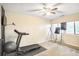 Bonus room with a treadmill, exercise ball, and ample natural light from two windows at 4266 Roswell Ne Rd # L3, Atlanta, GA 30342