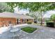 Common outdoor courtyard with picnic tables, grills, and seating areas perfect for entertaining guests at 4266 Roswell Ne Rd # L3, Atlanta, GA 30342