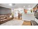 Inviting living room with a brown leather sofa, open to the dining area and kitchen, offering a seamless living space at 4266 Roswell Ne Rd # L3, Atlanta, GA 30342