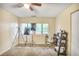 Bright office space with two windows, a ceiling fan, and a comfortable white desk chair at 4266 Roswell Ne Rd # L3, Atlanta, GA 30342