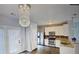 Modern kitchen features stainless steel appliances, granite countertops, stylish lighting, and ample storage space at 4397 Stone Gate Way, Atlanta, GA 30344