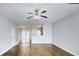 Spacious living room with hardwood floors, ceiling fan, and open layout to kitchen, great for entertaining at 4397 Stone Gate Way, Atlanta, GA 30344