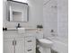 Updated bathroom featuring a vanity, toilet, and tub with modern fixtures at 232 Barrett Springs Way, Canton, GA 30115