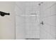Modern shower with white tile, built-in niche, and sleek fixtures at 232 Barrett Springs Way, Canton, GA 30115
