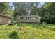 Backyard with a clothesline and shed, providing practical amenities and storage solutions at 433 Pine Dr, Pine Lake, GA 30072