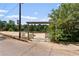 Inviting beach entrance with a wooden pergola and access to a sandy beach area at 433 Pine Dr, Pine Lake, GA 30072