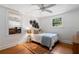 Bright bedroom with hardwood floors, natural light, and a neutral color palette at 433 Pine Dr, Pine Lake, GA 30072
