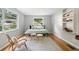 Serene bedroom with light grey walls, hardwood floors, and natural light at 433 Pine Dr, Pine Lake, GA 30072