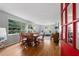 Bright dining room features hardwood floors and large windows with beautiful natural light at 433 Pine Dr, Pine Lake, GA 30072