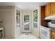Kitchen nook featuring a white door with glass panels offering bright views at 433 Pine Dr, Pine Lake, GA 30072