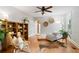 Inviting living room featuring hardwood floors, a cozy reading nook, and neutral tones at 433 Pine Dr, Pine Lake, GA 30072