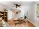 Bright living room with hardwood floors, stylish furniture, and ample natural light at 433 Pine Dr, Pine Lake, GA 30072