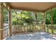 View from the screened porch surrounded by a lush, green yard at 433 Pine Dr, Pine Lake, GA 30072