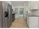 Kitchen with stainless steel appliances and white cabinetry at 506 Bluff Ct, Woodstock, GA 30188