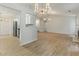 Bright and open floor plan with modern lighting and hardwood floors at 506 Bluff Ct, Woodstock, GA 30188