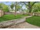 A concrete retaining wall borders a level and grassy backyard at 1001 Dunning Se St, Atlanta, GA 30315