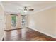 Bedroom with hardwood floors, a ceiling fan, windows, and natural light at 1001 Dunning Se St, Atlanta, GA 30315