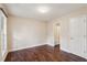 Bedroom with hardwood floors, base trim, and ensuite bathroom at 1001 Dunning Se St, Atlanta, GA 30315