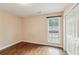 Bedroom with hardwood floors, a window, and a double door closet at 1001 Dunning Se St, Atlanta, GA 30315