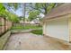 View of the backyard and a detached garage with an overhead door at 1001 Dunning Se St, Atlanta, GA 30315