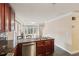 Cozy kitchen featuring dark wood cabinets, stainless steel appliances, and granite countertops at 1001 Dunning Se St, Atlanta, GA 30315