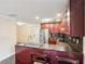 This kitchen features dark cabinets, stainless steel appliances, granite countertops, and barstool seating at 1001 Dunning Se St, Atlanta, GA 30315