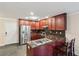 Modern kitchen with dark cabinets, granite countertops, stainless steel appliances, and a breakfast bar with seating at 1001 Dunning Se St, Atlanta, GA 30315