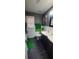 Charming bathroom with double vanity, modern fixtures, wainscoting, and colorful accents at 1033 Hawk Creek Trl, Lawrenceville, GA 30043
