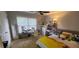 Cozy bedroom featuring a comfortable bed, natural light, and a functional workspace at 1033 Hawk Creek Trl, Lawrenceville, GA 30043