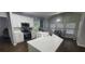 Kitchen featuring white countertops, stainless steel appliances, and dark wood floors at 1033 Hawk Creek Trl, Lawrenceville, GA 30043