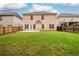 Expansive backyard with lush green grass and a sturdy wooden fence, perfect for outdoor activities at 1076 Scenic Park Trl, Lawrenceville, GA 30046