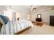 Spacious bedroom with neutral carpet, ceiling fan, and access to a walk-in closet at 1076 Scenic Park Trl, Lawrenceville, GA 30046