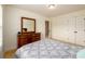 Inviting bedroom with a large dresser, closet, and comfortable bed perfect for relaxation at 1076 Scenic Park Trl, Lawrenceville, GA 30046