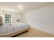 Bedroom with light walls, neutral carpet, and window at 1076 Scenic Park Trl, Lawrenceville, GA 30046