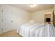 Bedroom with light walls, neutral carpet, and closet at 1076 Scenic Park Trl, Lawrenceville, GA 30046