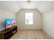 Bonus room with window, and television with media console stand at 1076 Scenic Park Trl, Lawrenceville, GA 30046